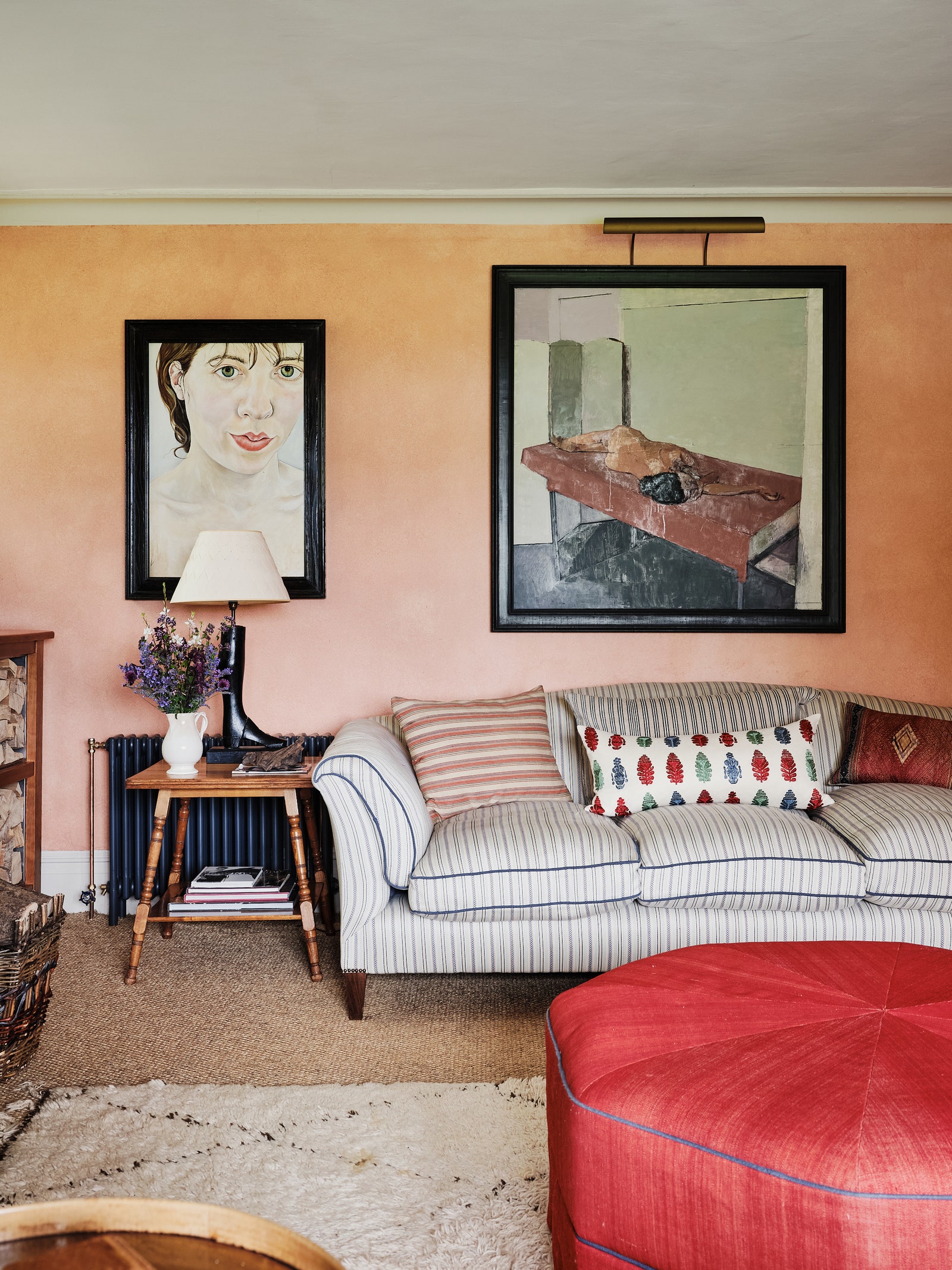 A portrait of a woman by Ishbel Myerscough hangs next to an Andy Pankhurst