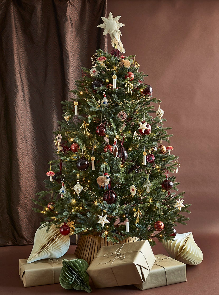 Image may contain Christmas Christmas Decorations Festival Christmas Tree Plant Tree Candle and Box
