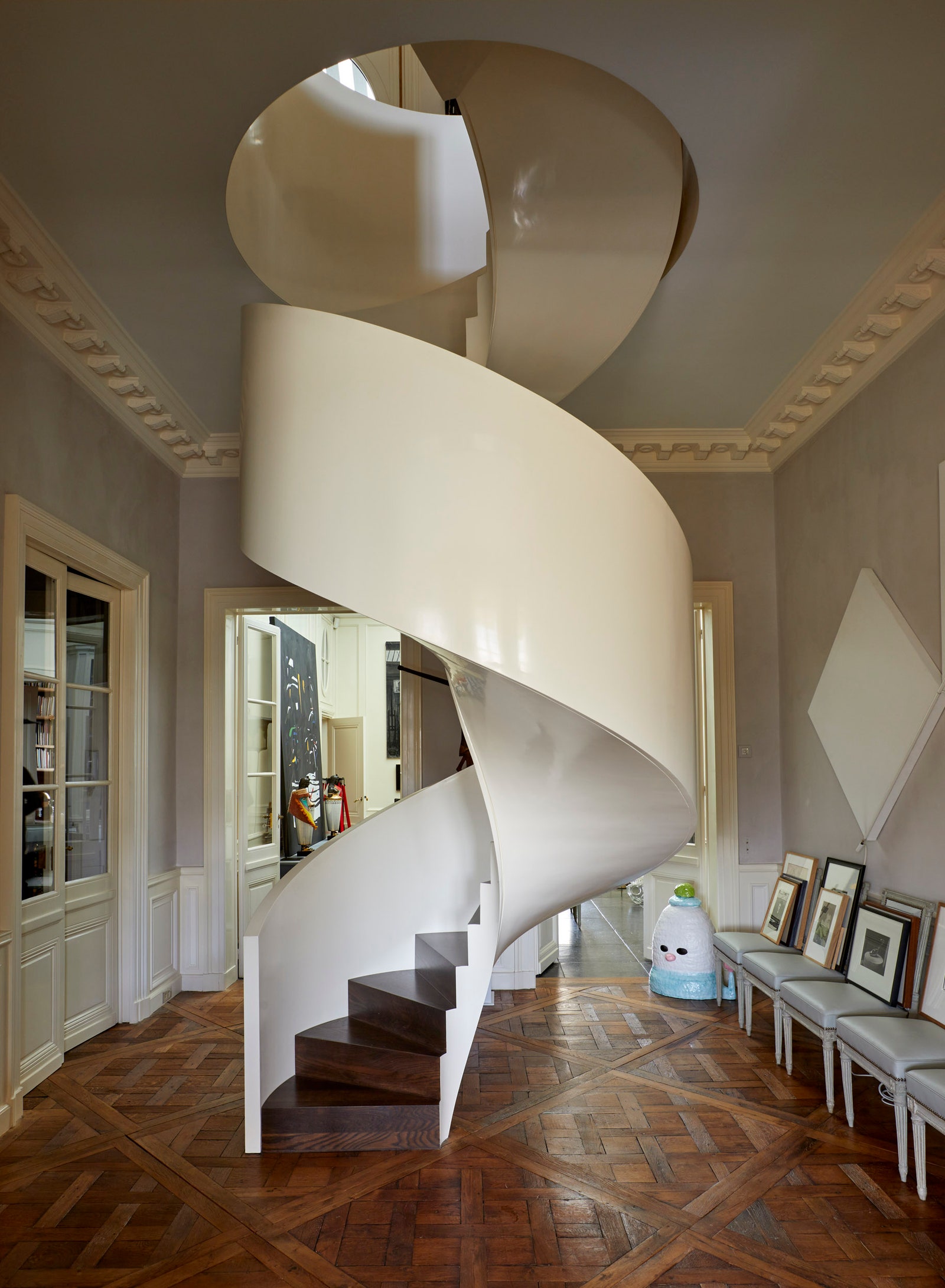 Image may contain Architecture Building House Housing Staircase Floor Indoors Interior Design Flooring and Person