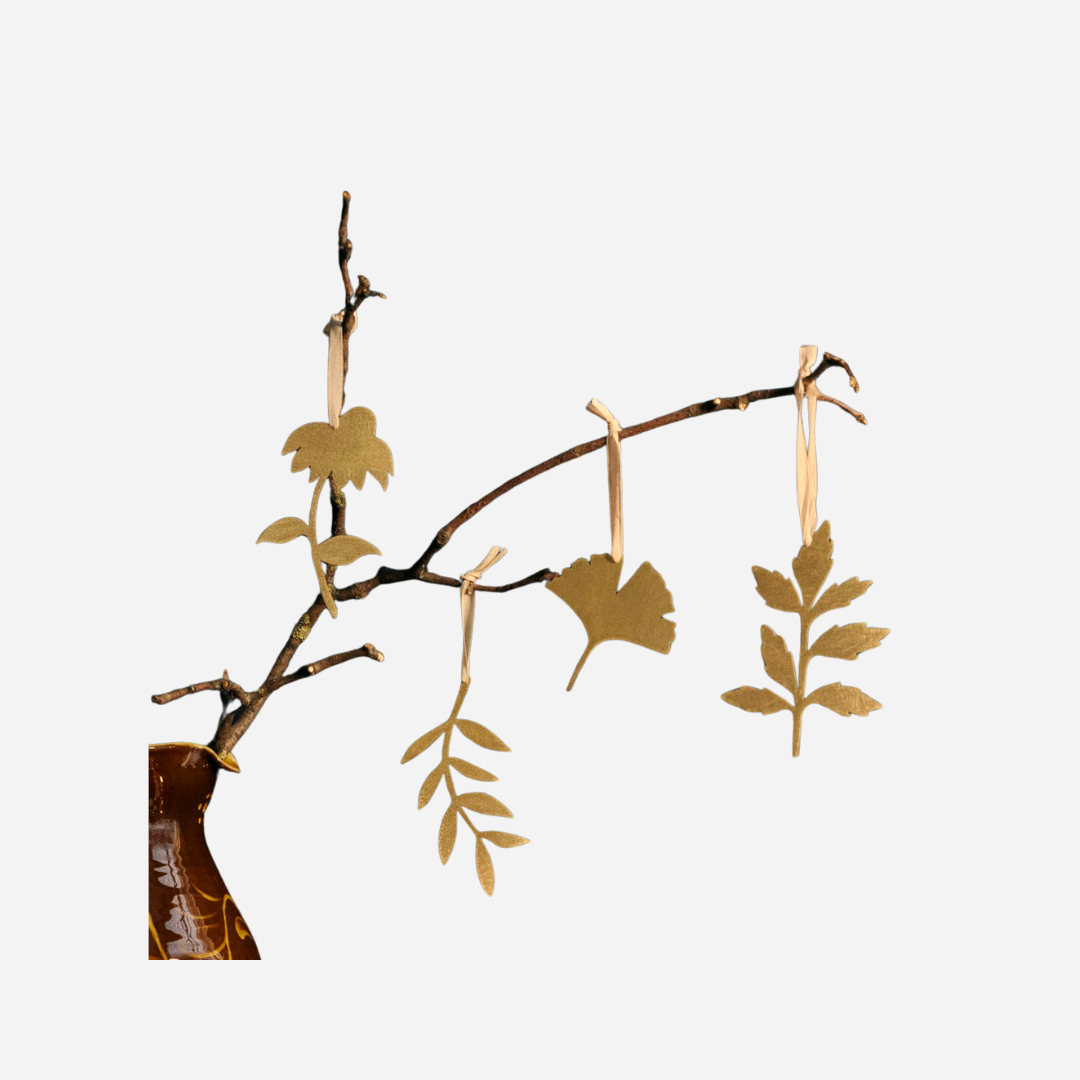 Image may contain: Leaf, Plant, Tree, Flower, Flower Arrangement, Accessories, Earring, Jewelry, and Art